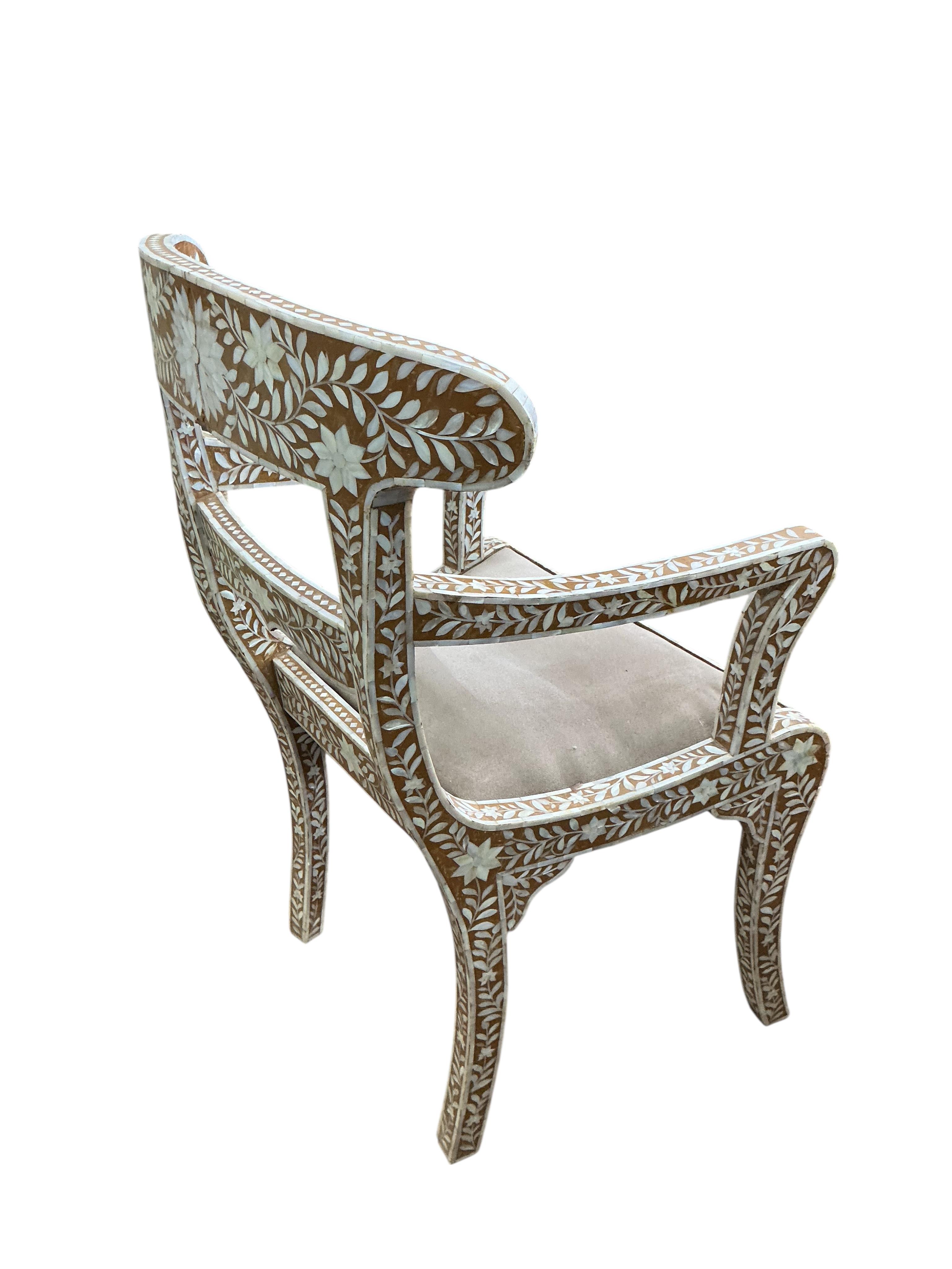 A 19th century Anglo Indian mother of pearl inlaid elbow chair, width 56cm, depth 44cm, height 90cm